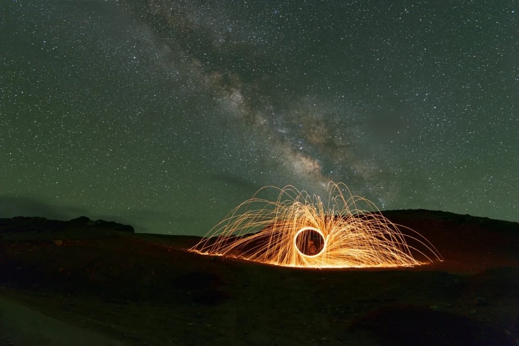 volcano is bursting in a night sky.